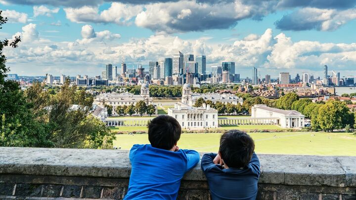 Credit: Fas Khan via UnsplashTwo boys looking at a skyline of London from Greenwich with pockets of green space